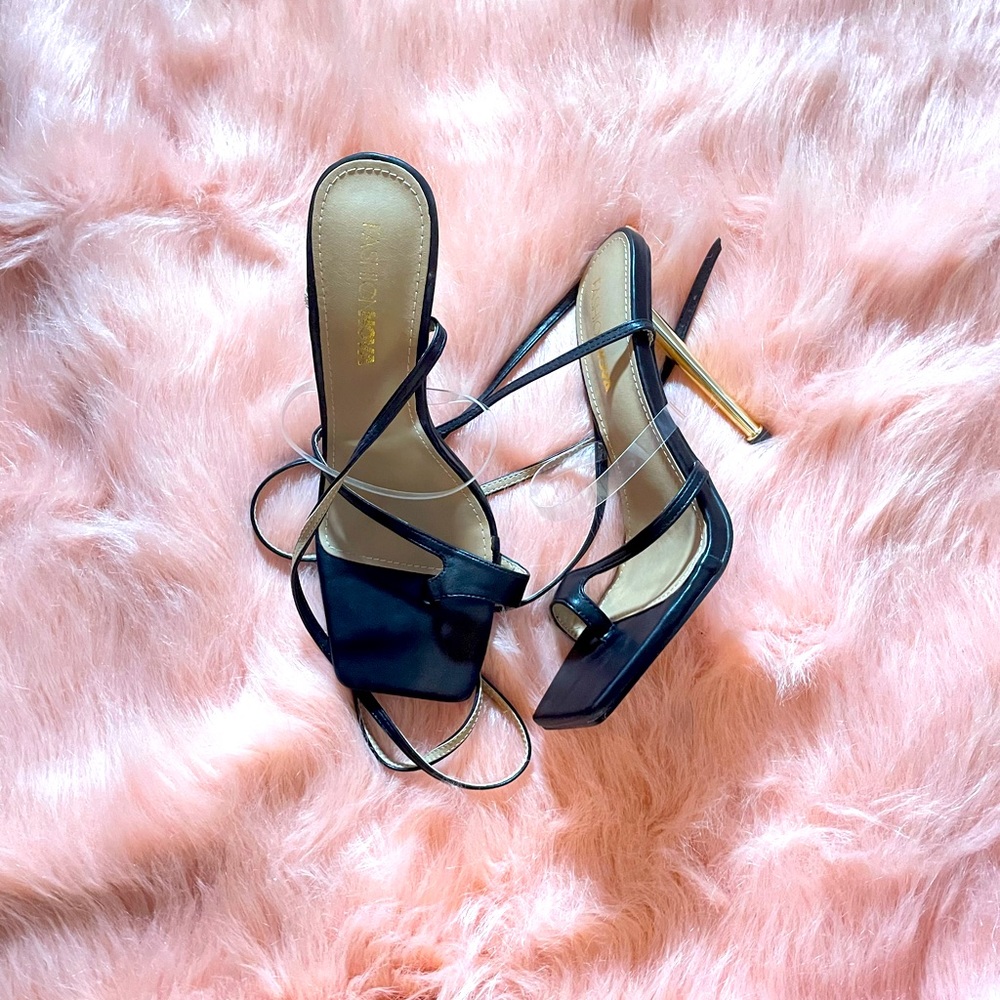 Black shoes with gold heels and straps. Size 7.5